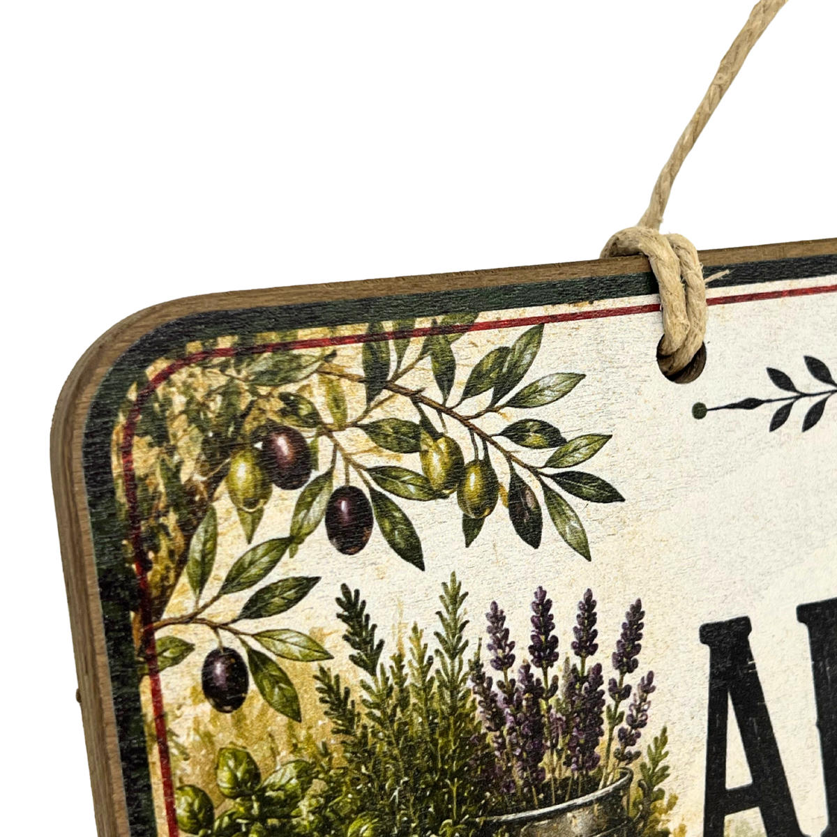 Close-up of a decorative hanging sign with a rustic vintage design, featuring olive branches, herbs, and partial lettering on a cream background, suspended by a twine loop.