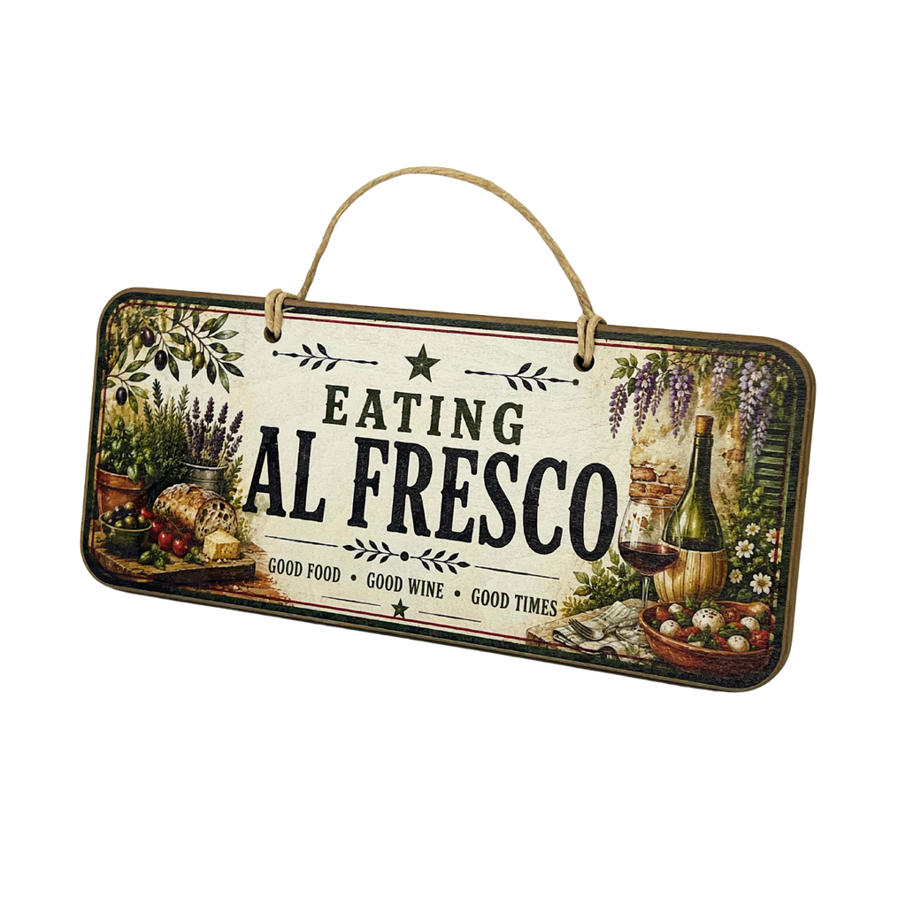A rectangular hanging wall sign with a rustic vintage design featuring the text 'EATING AL FRESCO' in bold black letters. The sign has a cream background with illustrations of food and wine, including grapes, a bottle, bread, and a bowl of salad, and is suspended by a natural jute rope handle against a plain white background.