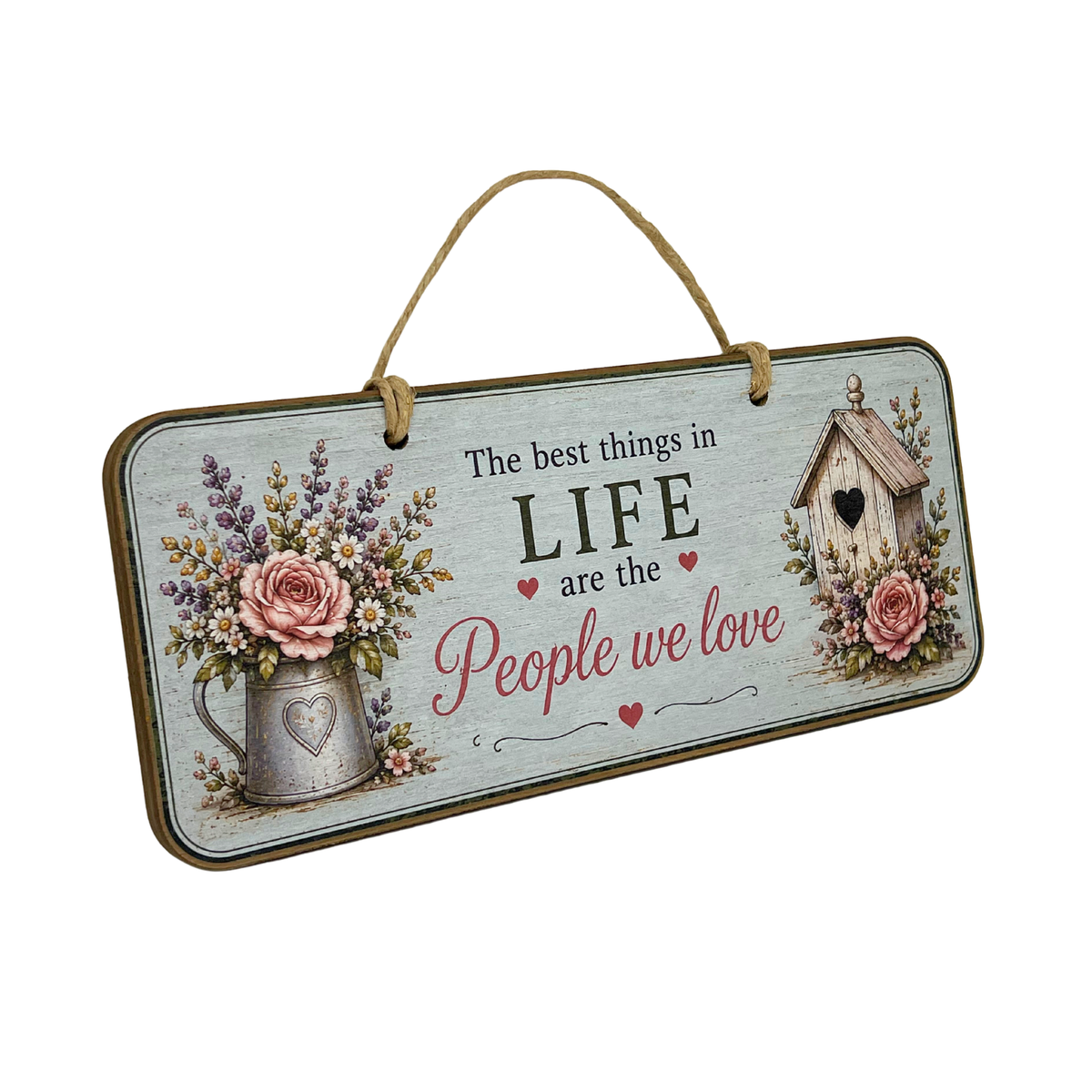 A rectangular hanging wall sign with a rustic wood-look finish, featuring the phrase 'The best things in LIFE are the People we love' in black and pink lettering. The sign is decorated with an illustration of a metal pitcher filled with pink roses and lavender on the left, and a small wooden birdhouse with a pink rose on the right.