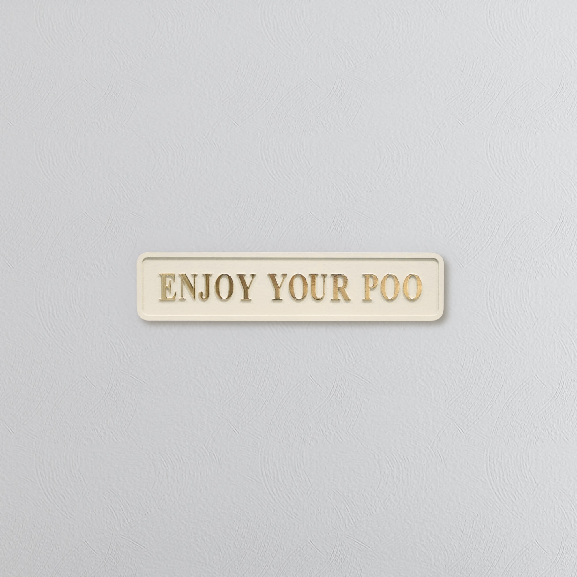 Cream and gold sign saying 'ENJOY YOUR POO'