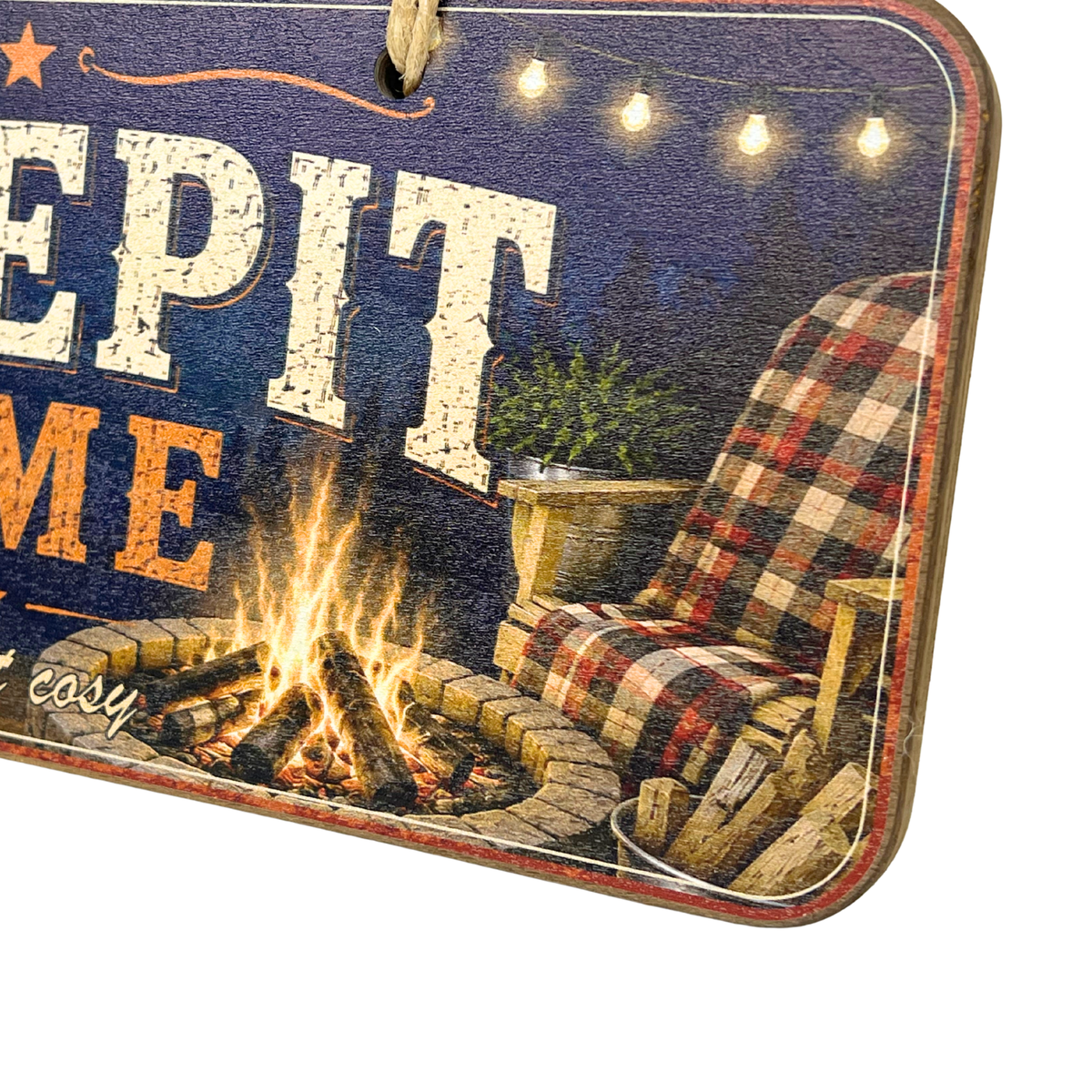 A rustic decorative sign with a distressed blue background, string lights, and an illustration of a campfire with a plaid chair. The sign is shown at an angle against a plain white background.