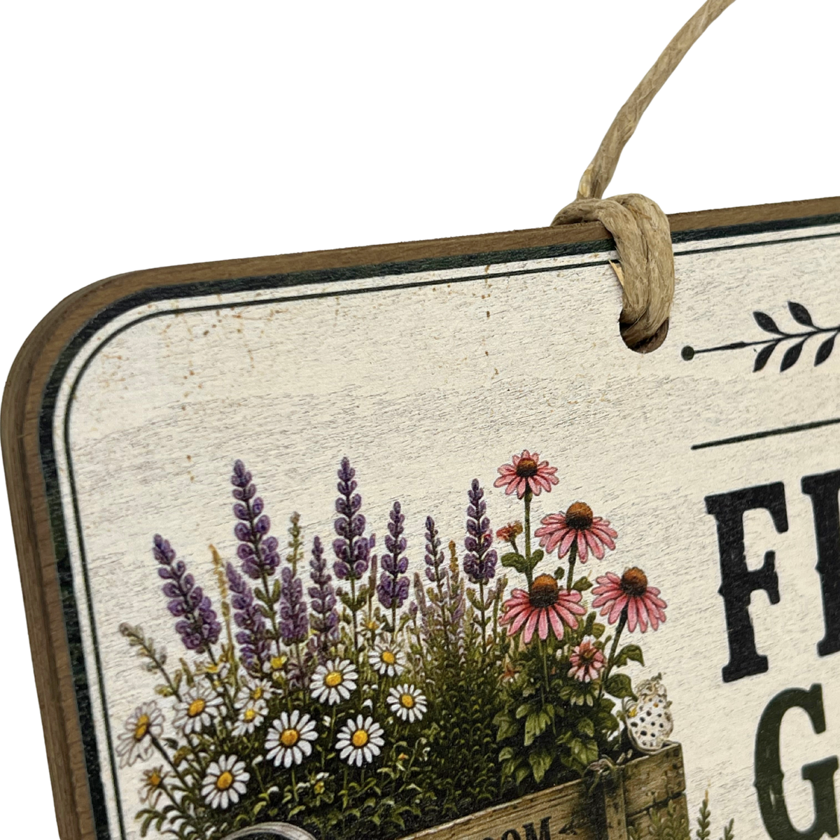 A rustic decorative hanging sign with a distressed cream background, a brown wood-look border, and an illustration of wildflowers including purple lavender, pink coneflowers, and white daisies. Part of the text reads 'FRI G' and the sign hangs from a natural jute rope.