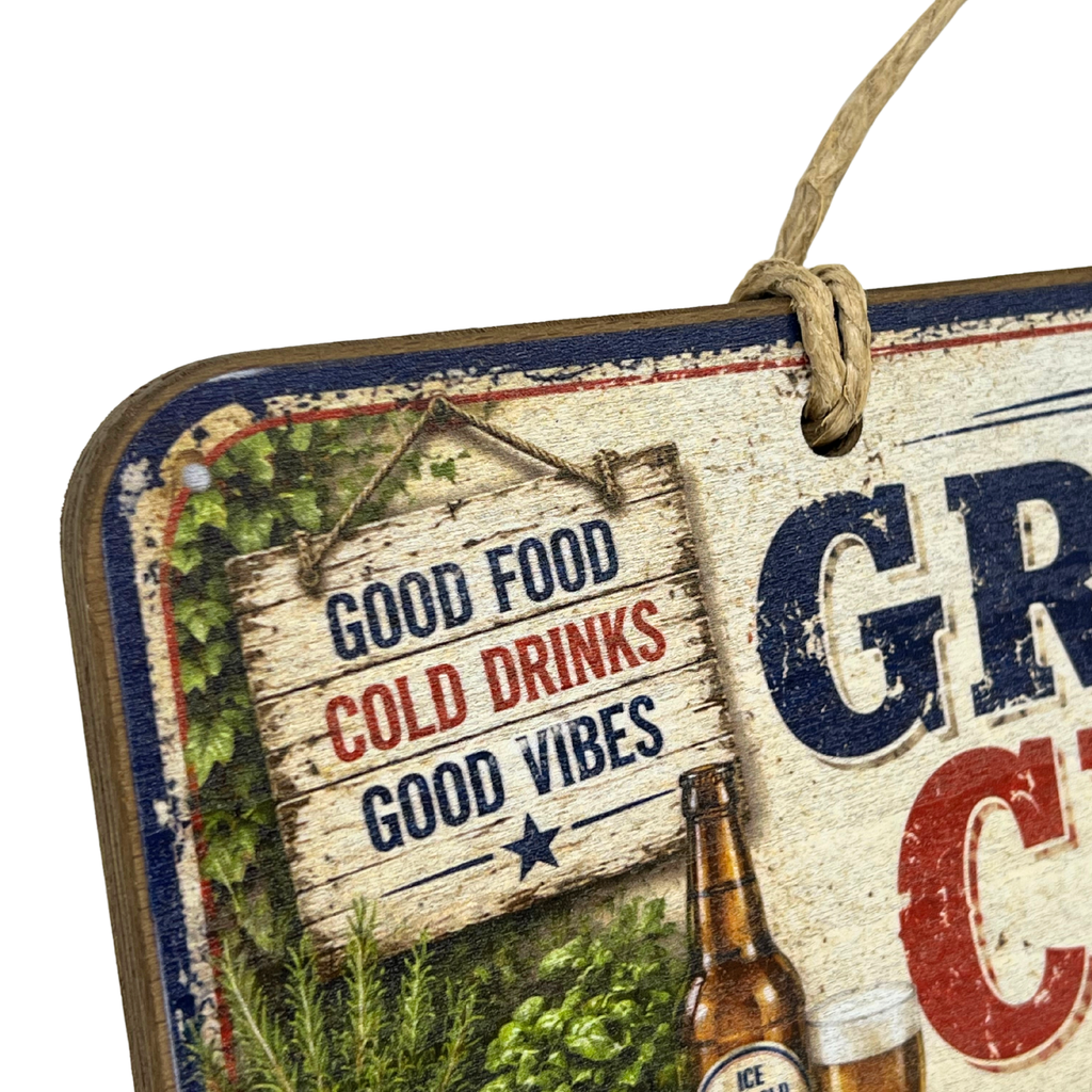 A rustic wooden hanging sign with a distressed vintage beer-themed design. The sign features a hanging wooden sign reading 'GOOD FOOD COLD DRINKS GOOD VIBES' in blue and red lettering, alongside illustrations of green hops, a brown beer bottle, and large blue and red letters on a cream background.