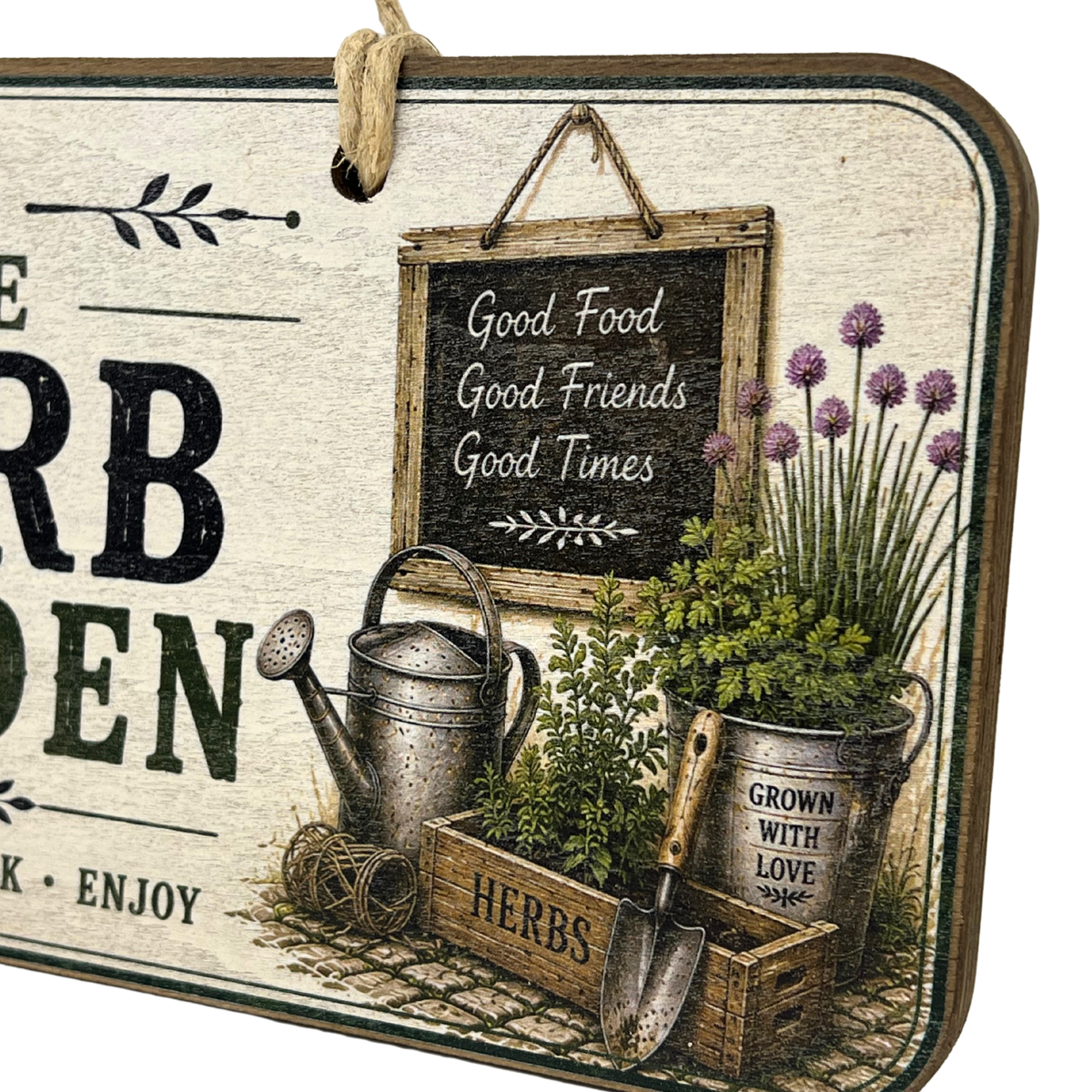 A rectangular decorative garden sign with a rustic vintage design, featuring a hanging rope, a small chalkboard sign reading 'Good Food Good Friends Good Times,' a watering can, a small hand trowel, potted herbs, and partial text including 'HERB GEDEN' and 'K - ENJOY.'.