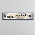 Decorative mirror sign with 'It is what it is' art deco style text on a gray background