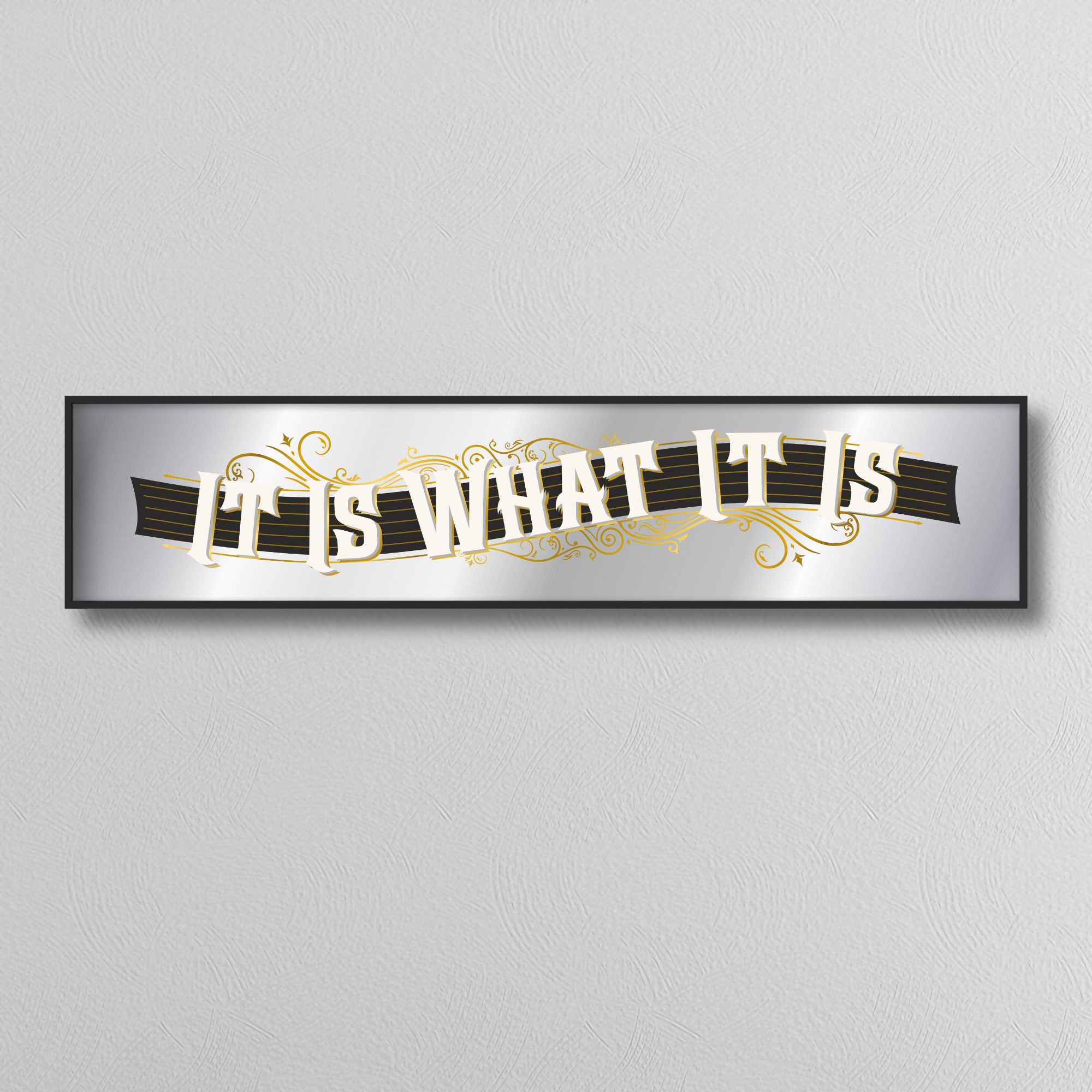 Decorative mirror sign with 'It is what it is' art deco style text on a gray background