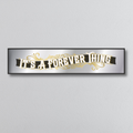 Decorative mirror sign with 'It's a Forever Thing' art deco style text on a gray background