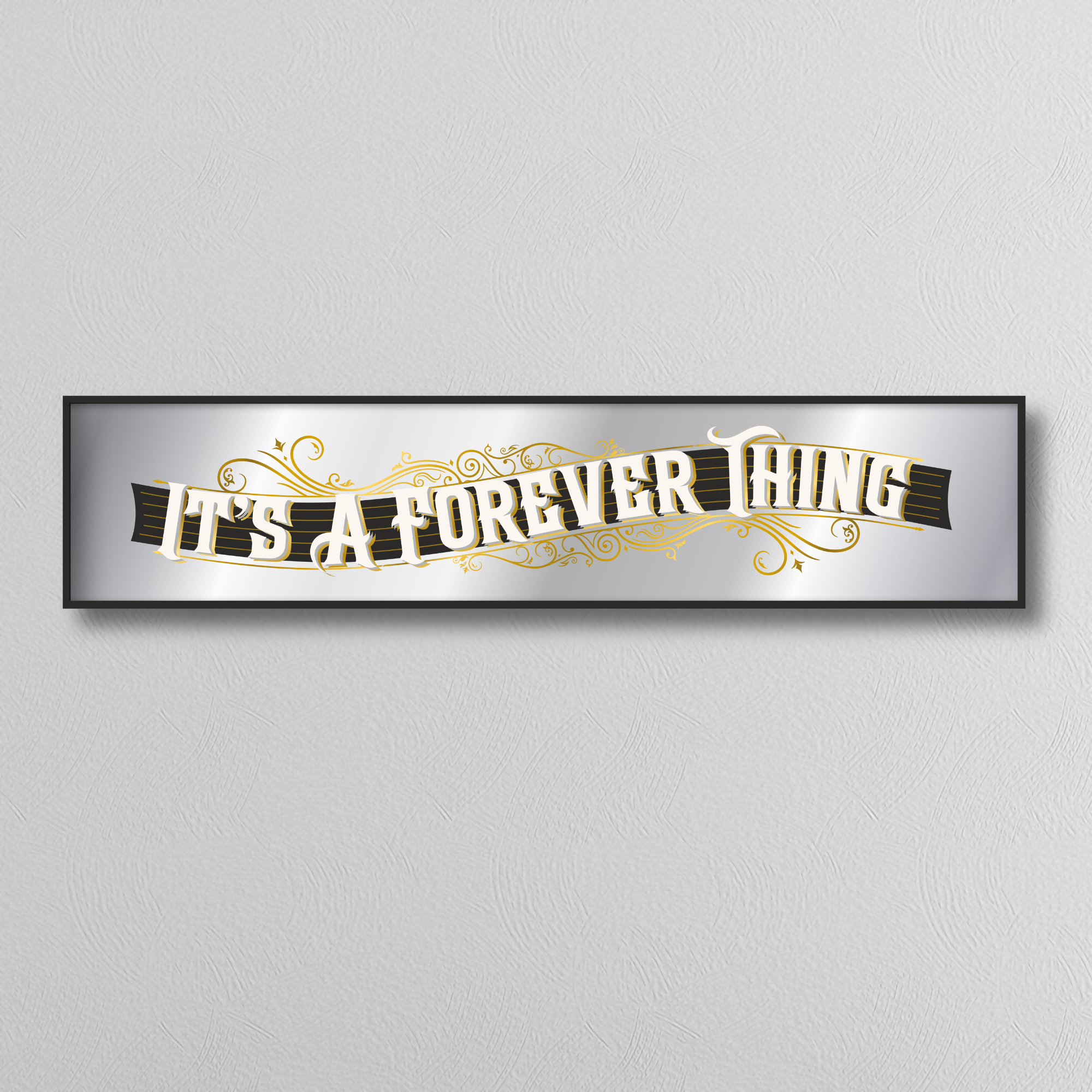 Decorative mirror sign with 'It's a Forever Thing' art deco style text on a gray background