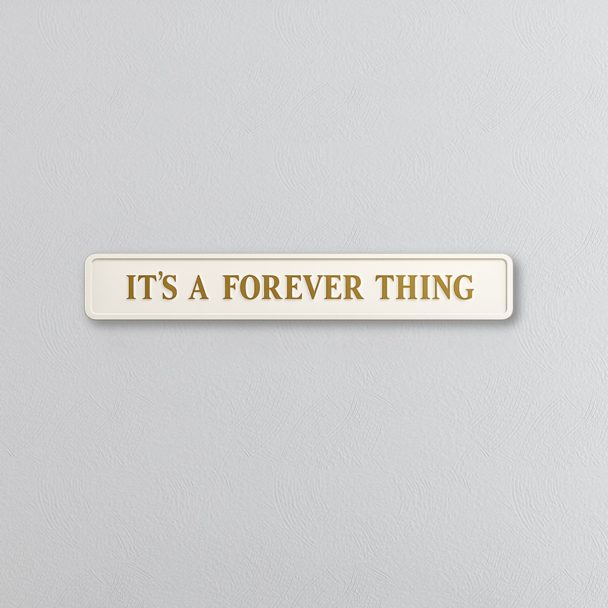 Rectangular sign with 'IT'S A FOREVER THING' text on a light gray background