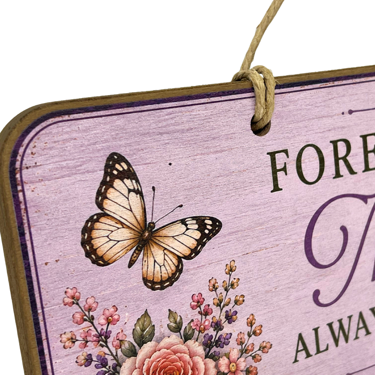A close-up of a decorative hanging sign with a lavender wood-grain background, a butterfly illustration, floral details, and partial text reading 'FOREVER' and 'ALWAYS'.