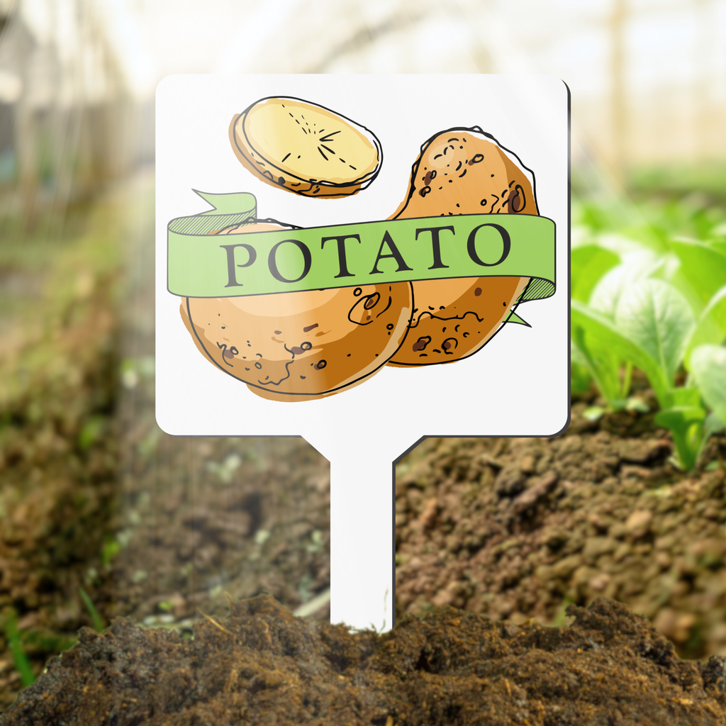 Garden marker with potato illustration and text in soil