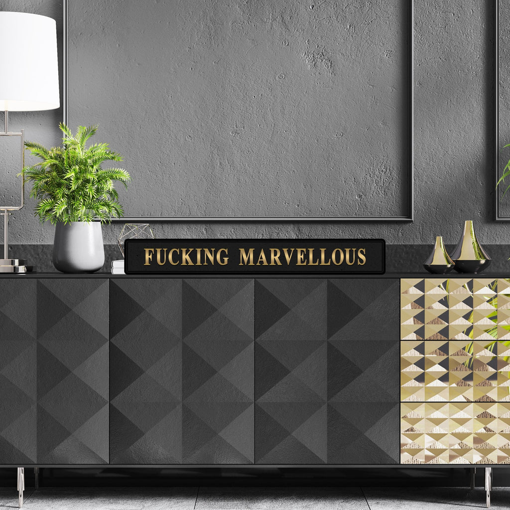 Black and gold foiled street sign with 'Fucking Marvellous' wording.