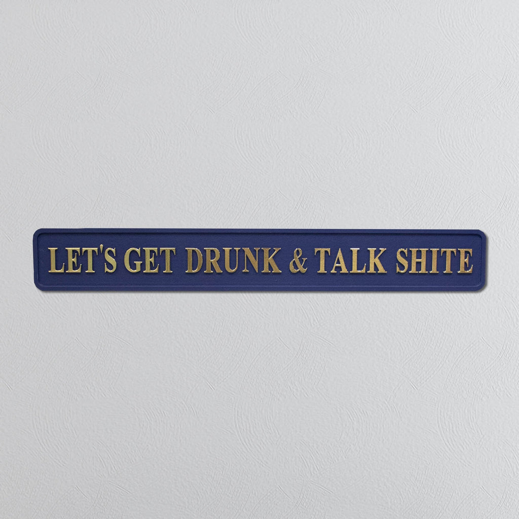 Navy blue sign with gold text on a light gray background