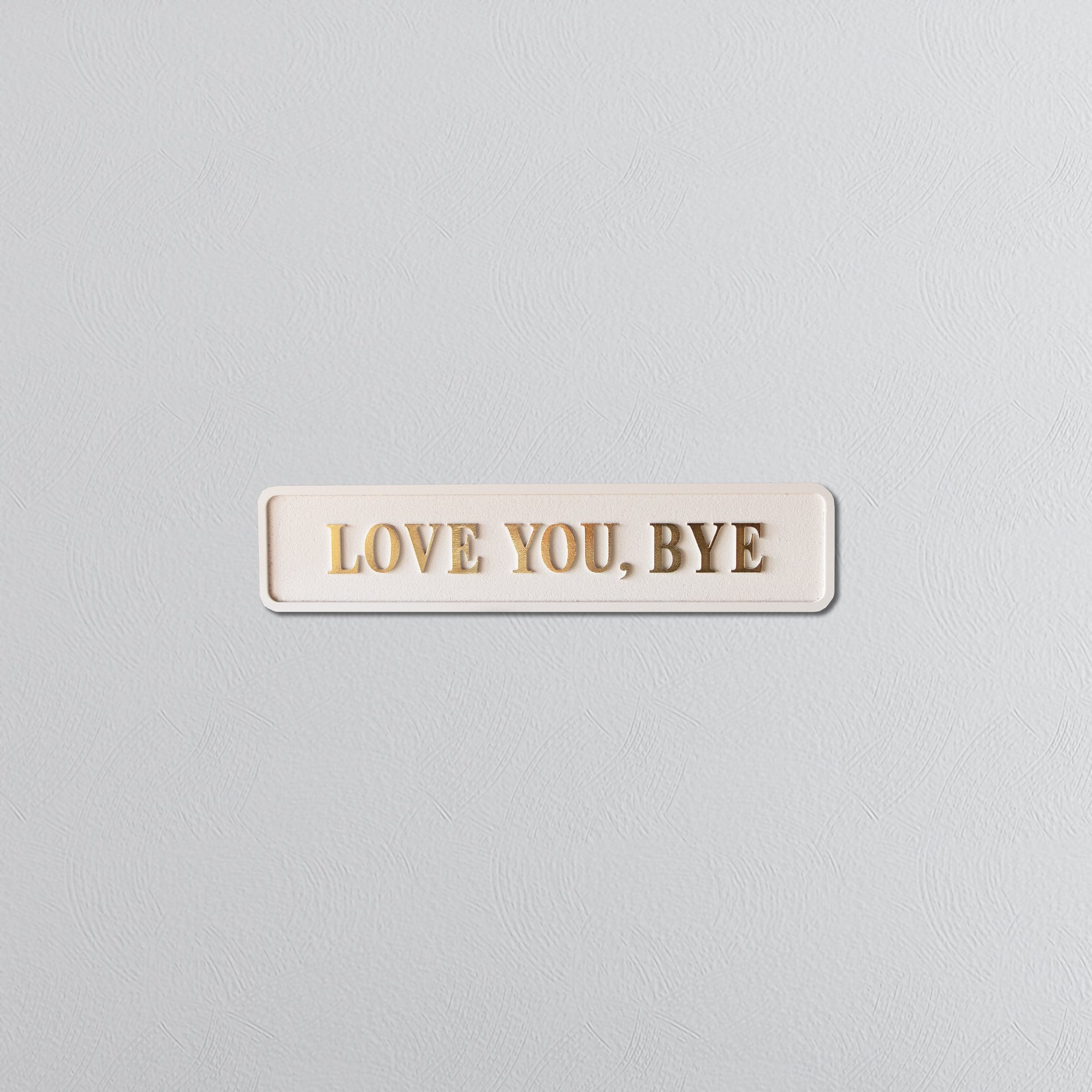 Cream and gold foiled street sign with "love you, bye" lettering