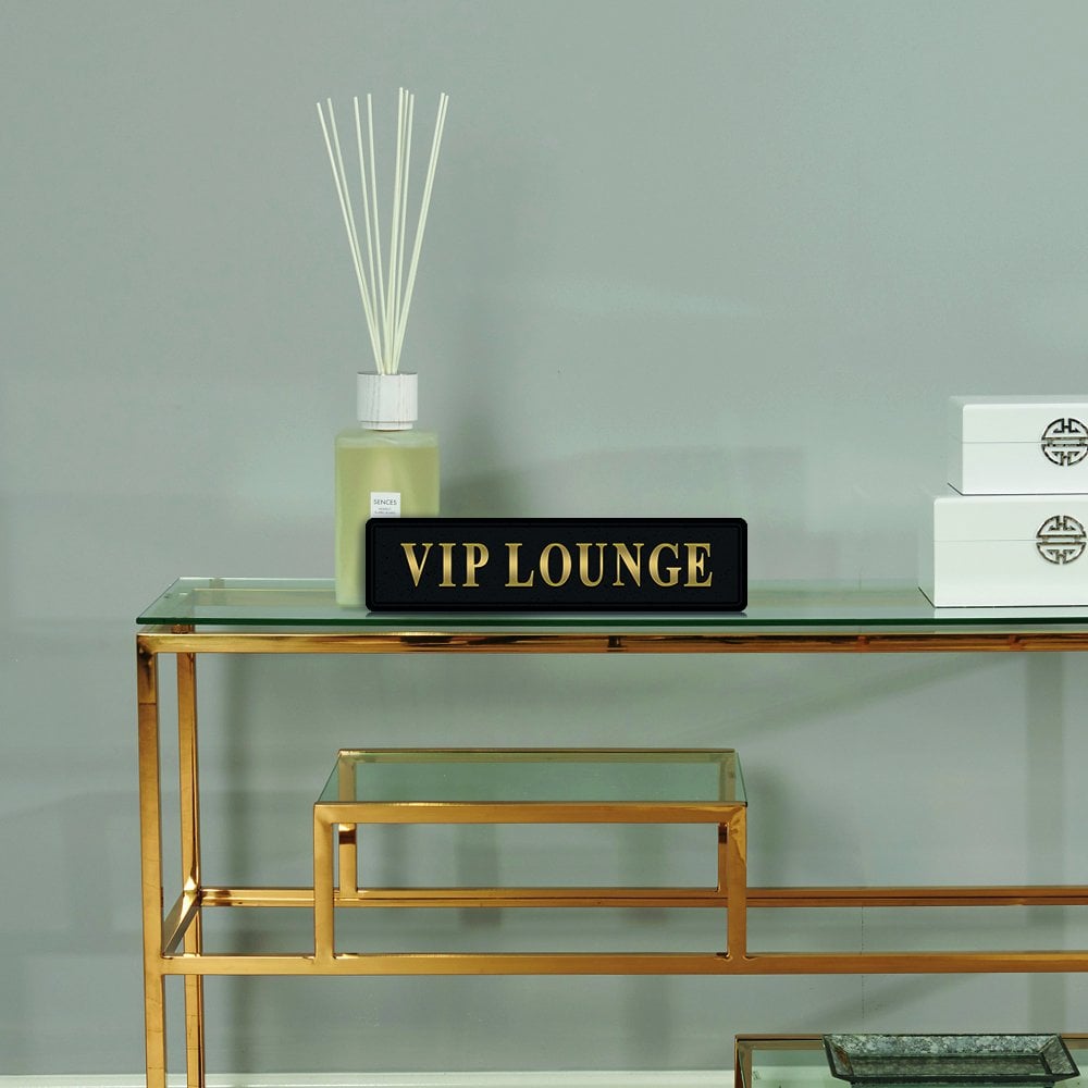 Black and gold foiled sign with 'VIP lounge' wording