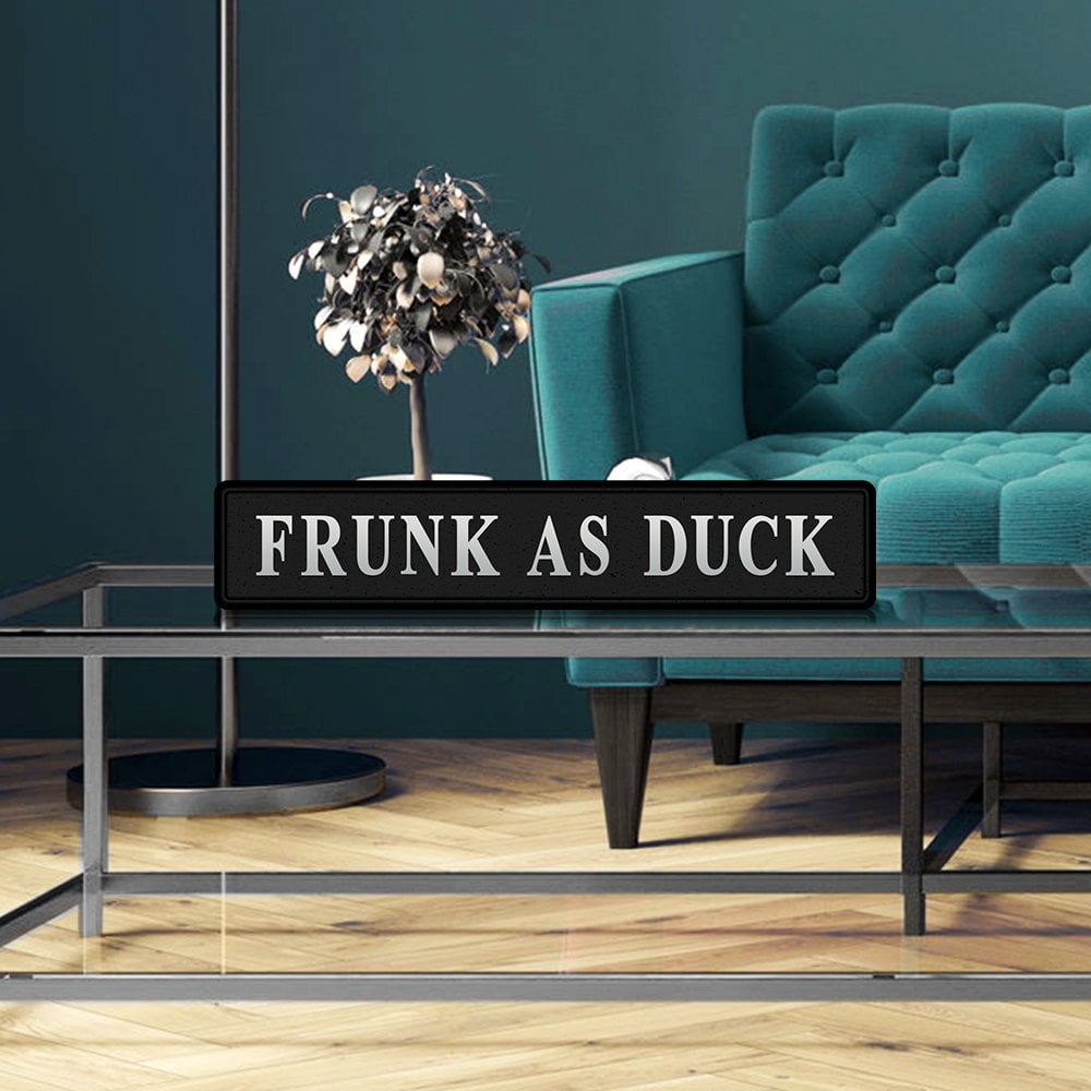 Black and silver foiled street sign with 'Frunk as duck' wording