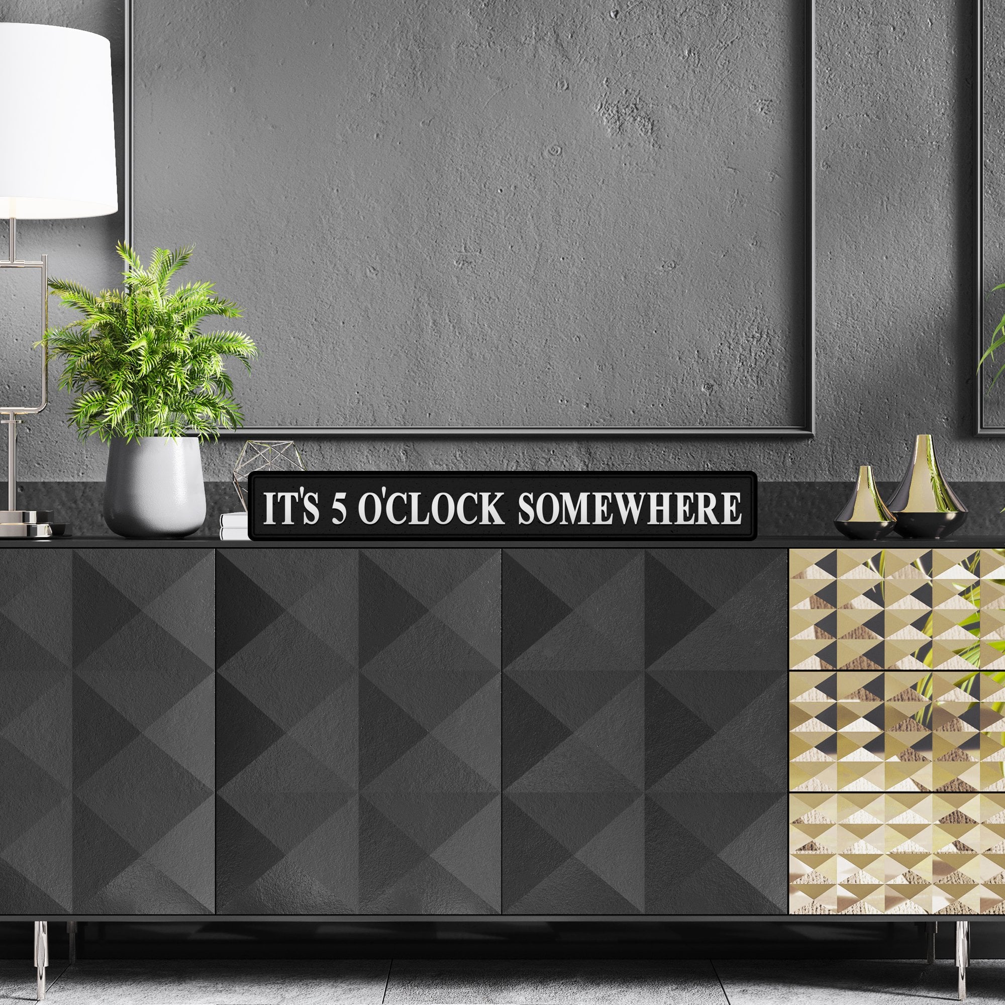 Black and silver foiled street sign with 'It's 5 o'clock somewhere' wording