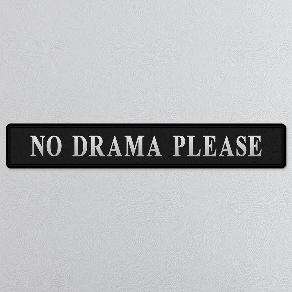 Black and silver foiled street sign with 'No drama please' wording