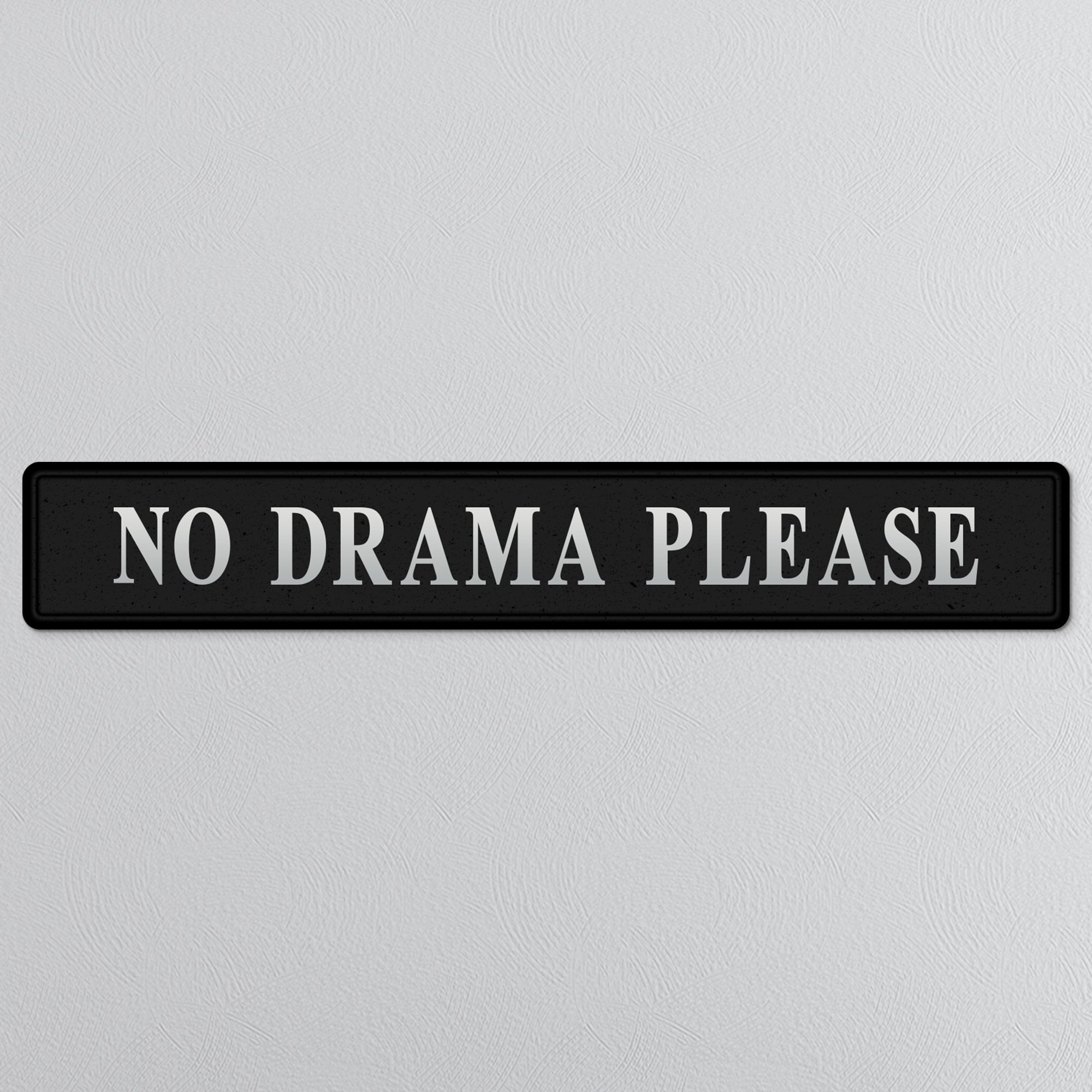 Black and silver foiled street sign with 'No drama please' wording