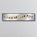 Decorative mirror sign with 'This is my happy place' art deco style text on a plain background