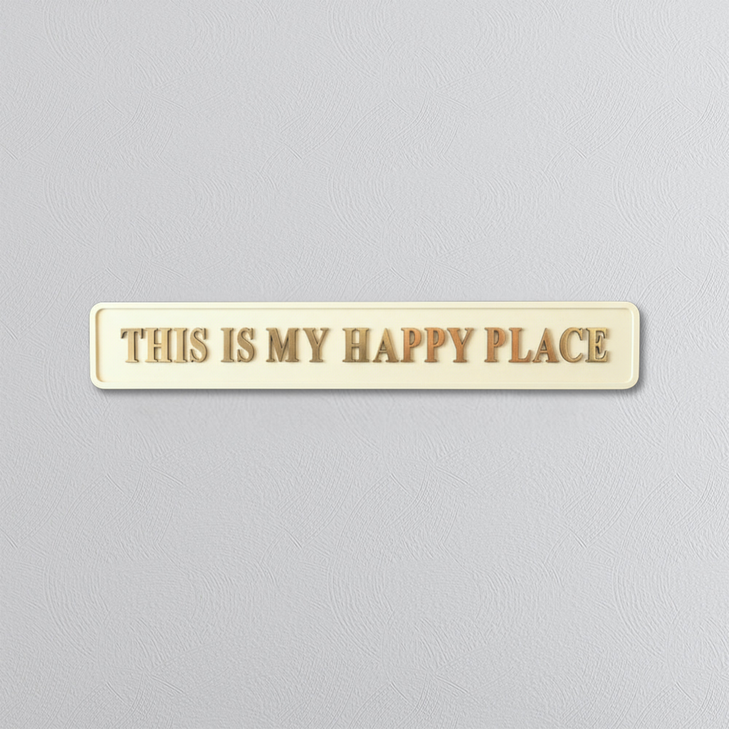 Rectangular plaque with 'THIS IS MY HAPPY PLACE' gold text on a gray background
