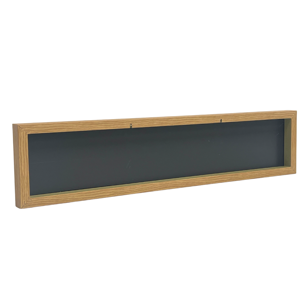 A long rectangular wall-mounted sign with a light natural wood frame, shown against a plain white background with 2 key slots for display.