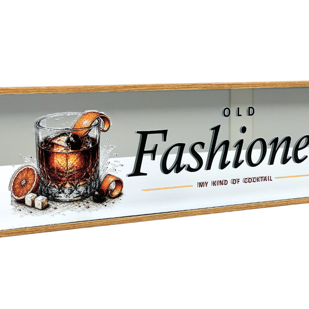 A rectangular decorative wall sign with a light wood border, featuring an illustration of an old fashion cocktail in a glass with orange slices and sugar cubes, alongside the text 'OLD Fashionione' and 'MY KIND OF COCKTAIL' on a white background.